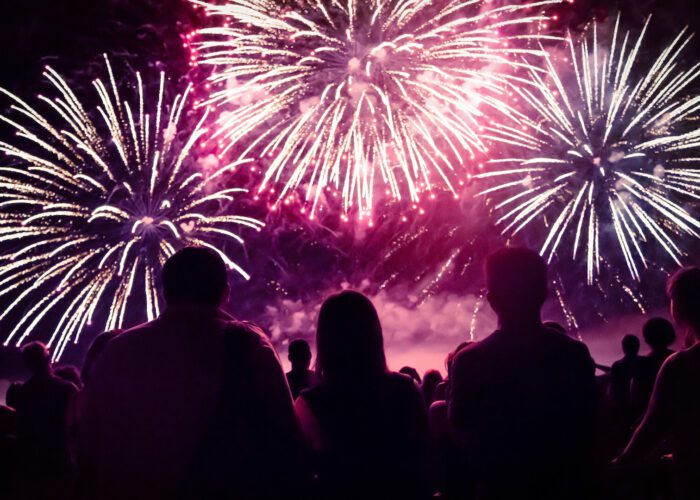 Crowd watching fireworks and celebrating new year eve