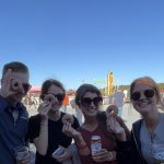 Group enjoying apple cider donuts at a farm in Massachusetts.