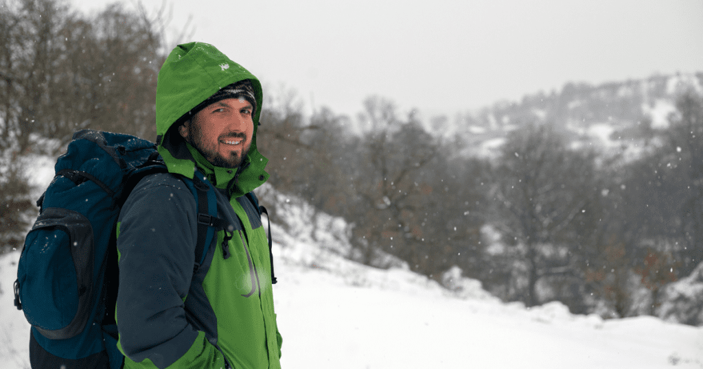 Snowing on hikers on a picturesque winter hike.