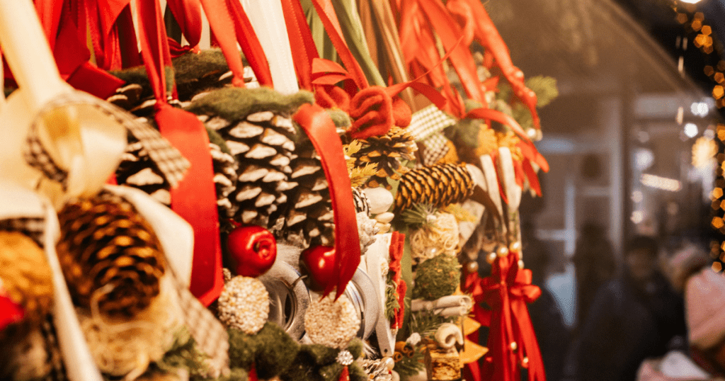 close up of pinecones and other holiday ornaments for same at a christmas market