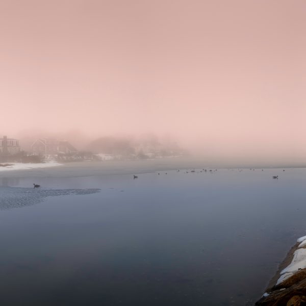 Peaceful foggy winter snowscape over the shoreline on Cape Cod, Massachusetts