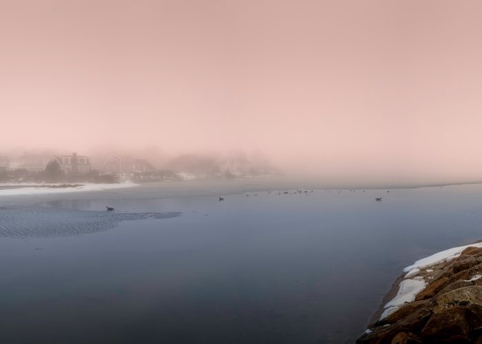 Peaceful foggy winter snowscape over the shoreline on Cape Cod, Massachusetts