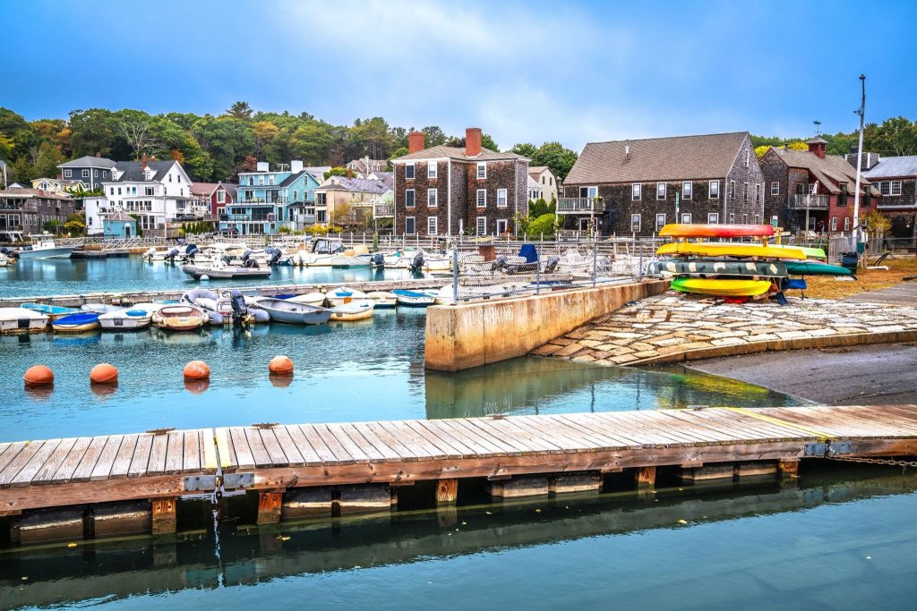 Manchester-by-the sea Harbor with boats and kayaks floating on a summer morning