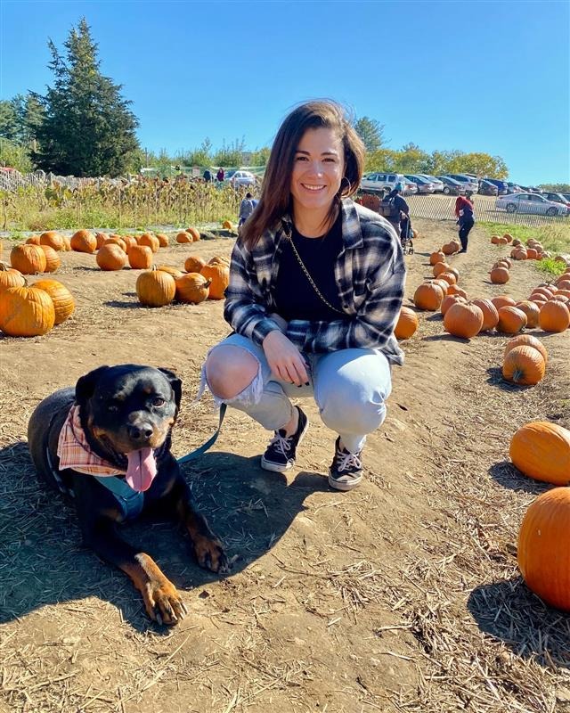  Keolis massAdventure’s director of Operations Camille with her Rottweiler Enzo at Smolak Farm’s Pumpkin Patch  in Andover Massachusetts 