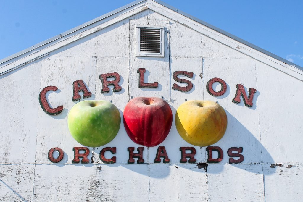Antique carlson orchards sign on the side of a barn in Harvard, MA
