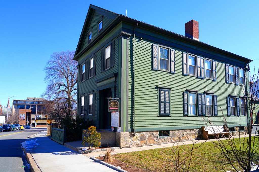 Exterior View of the Lizzie Borden House in Fall River with some snow on the ground.