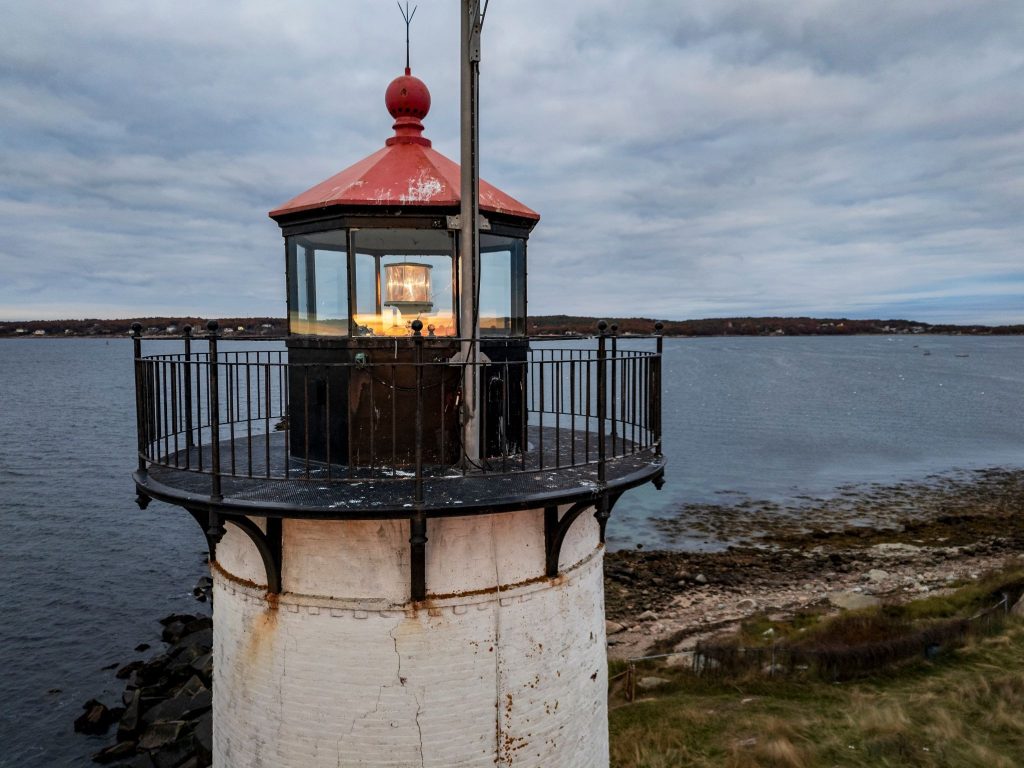 view of Gloucester, MA lighthouse on a dark, gloomy fall day